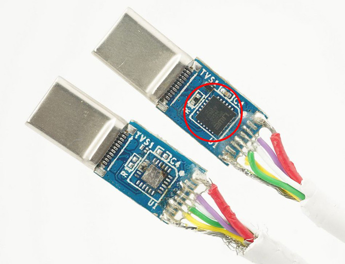 Exposed USB-C connector boards showing the internal e-marker electronics inside the connector housing.